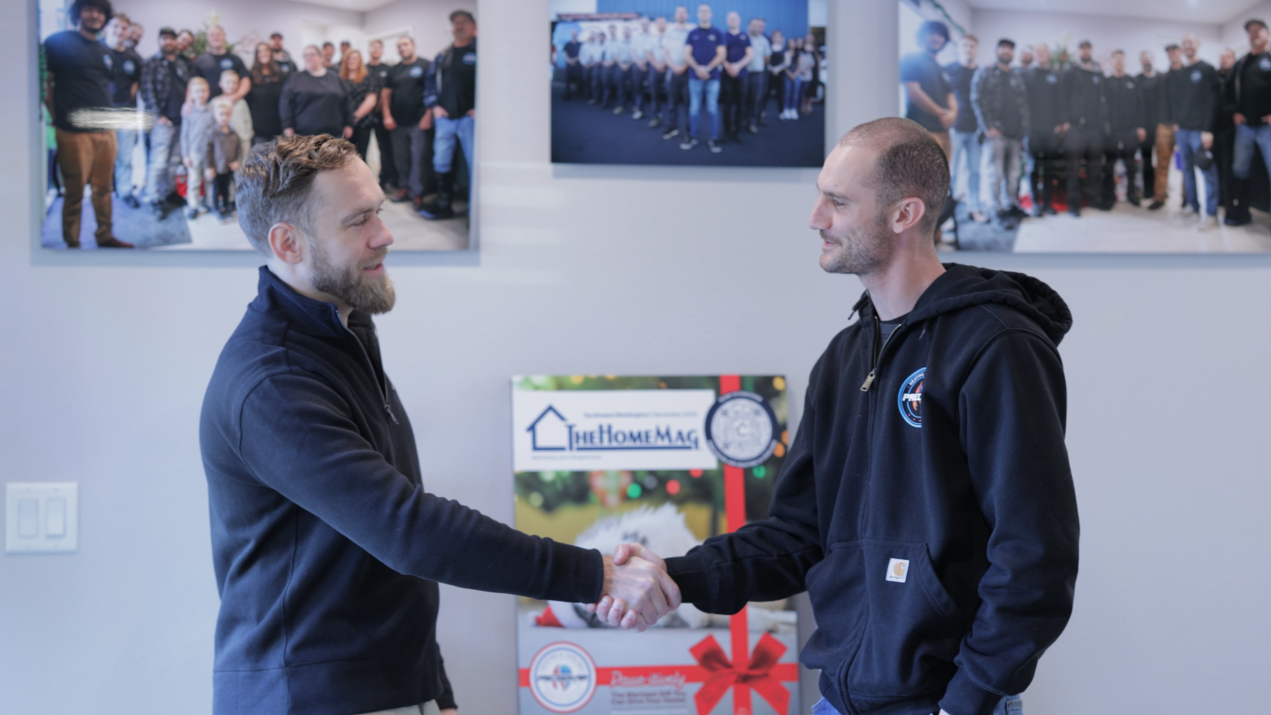 Larry shaking hands with Paul at the Precision headquarters office